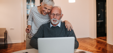 Senior man and woman on a laptop