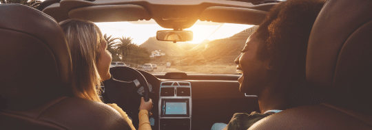 Two happy women in a car ride