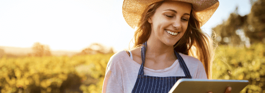 Woman with cowboy hat smiling