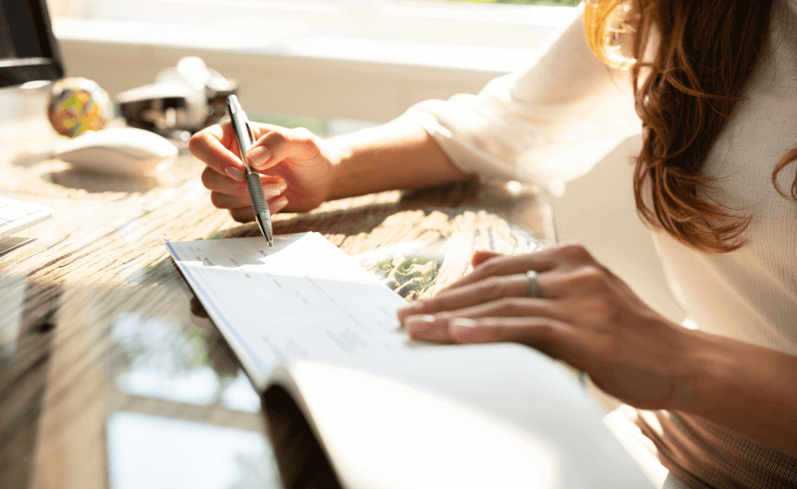 Woman writing in her checkbook