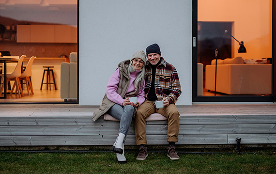 older couple sitting on deck