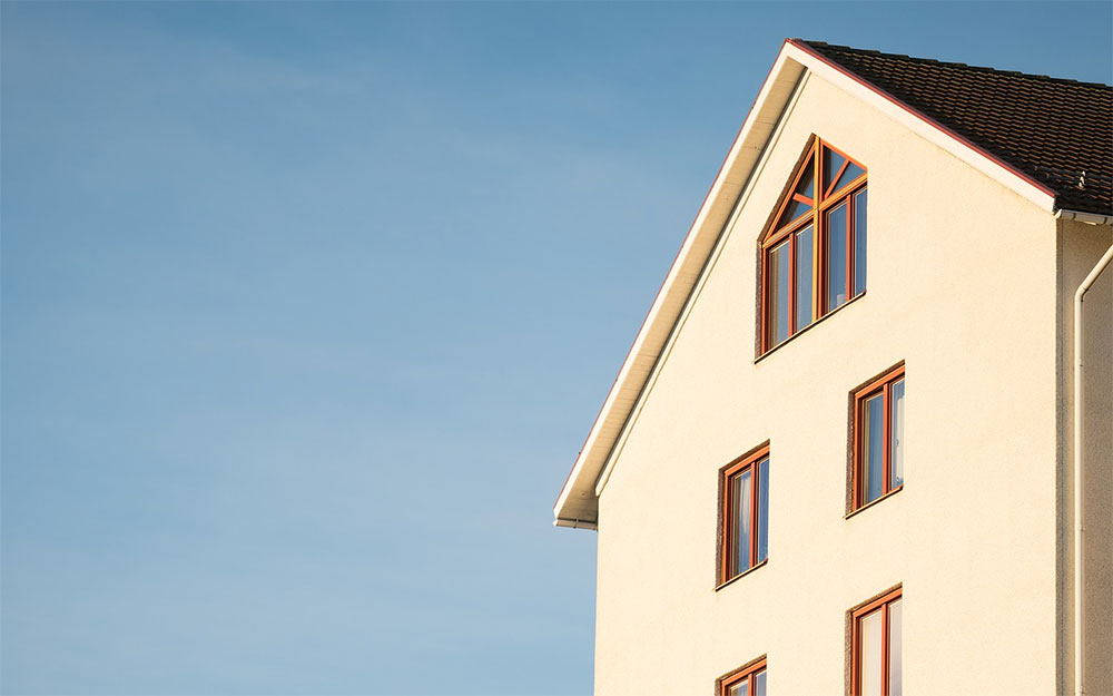 Yellow house with a blue sky background