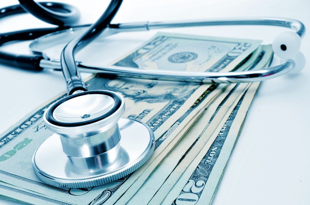 stethoscope and cash