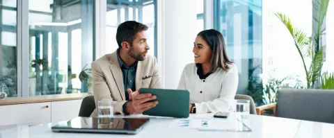 Man and woman talking about investment options
