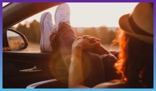 Woman looking out car window